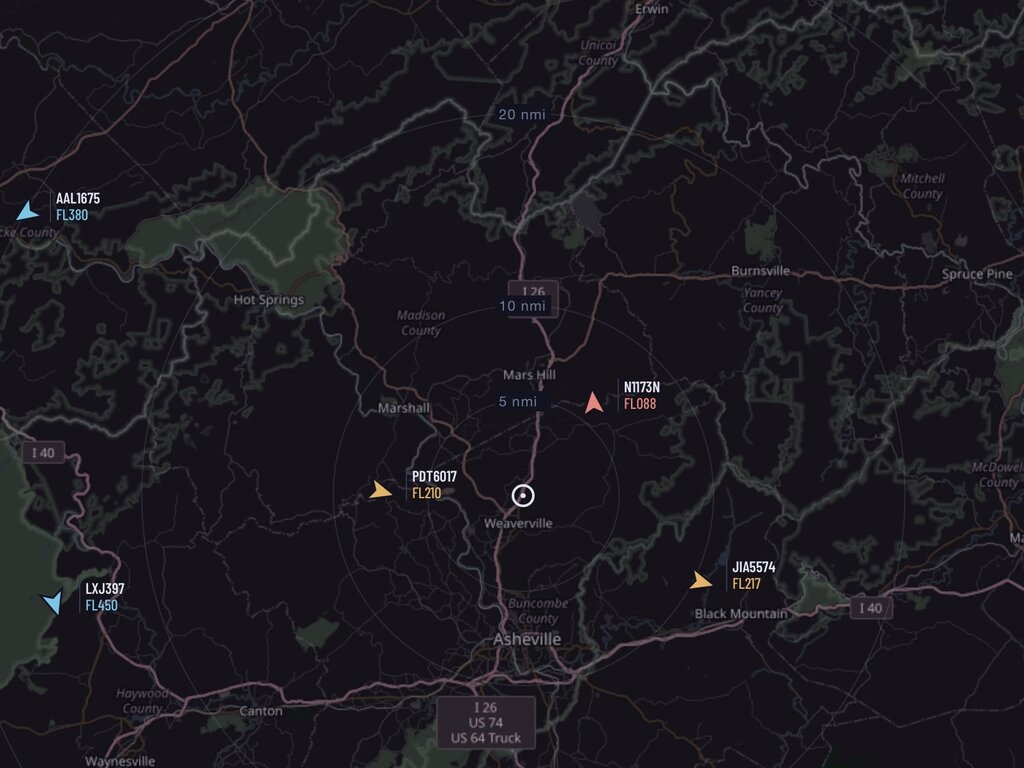 Overhead — a live map of aircraft in range, picked up by an SDR dongle and labeled with callsign and flight level